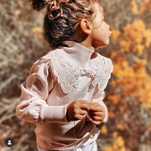 Beautiful turtleneck sweater with embroidered collar.